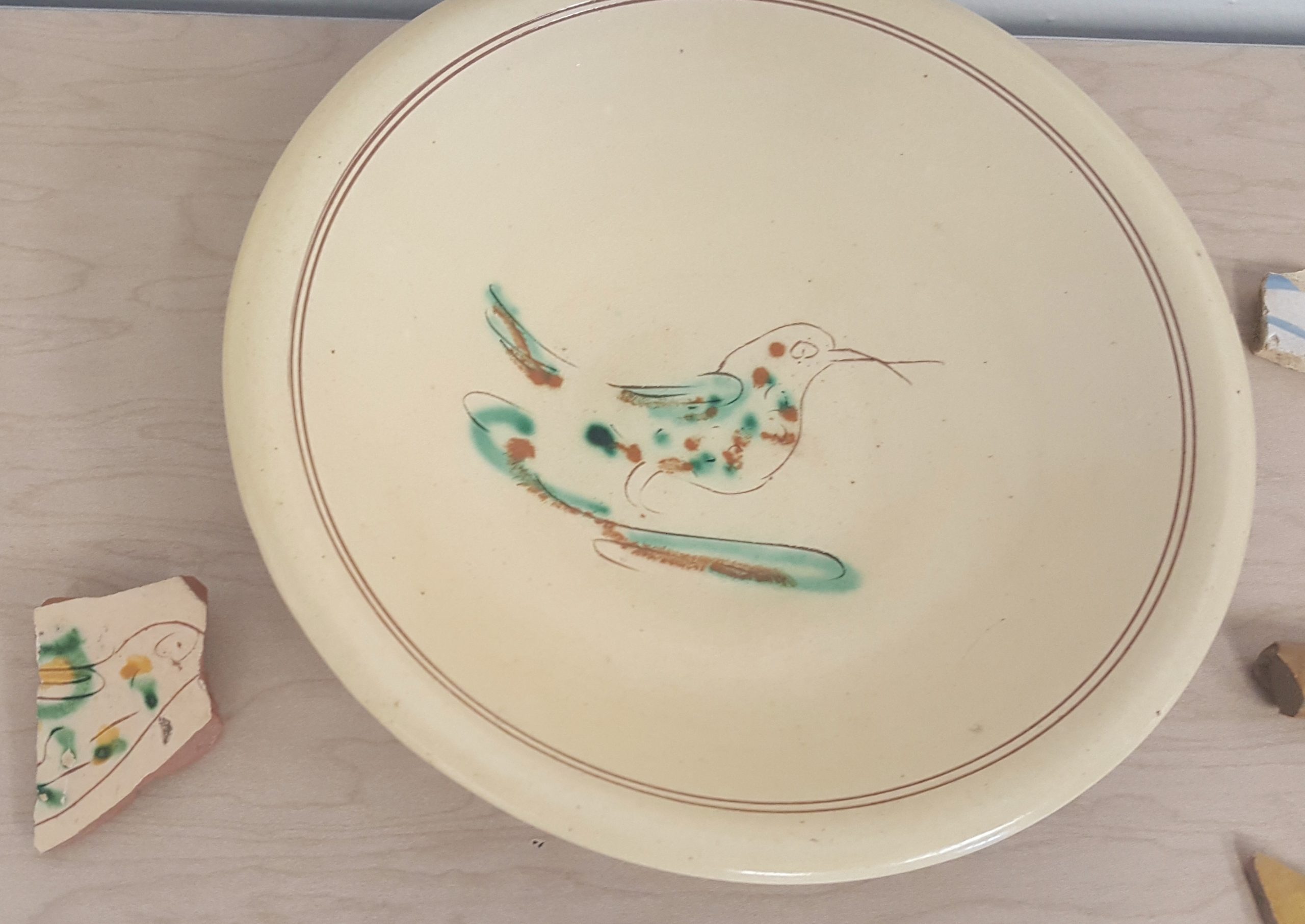 Plate sherd found at Whitemarsh that matches a replica plate Plate sherd found at Whitemarsh that matches a replica plate