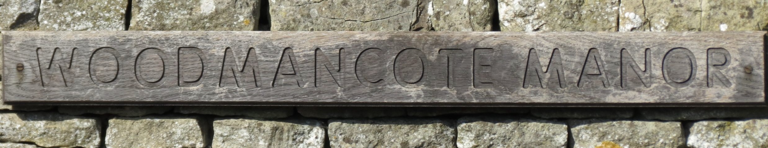 Woodmancote Manor Sign